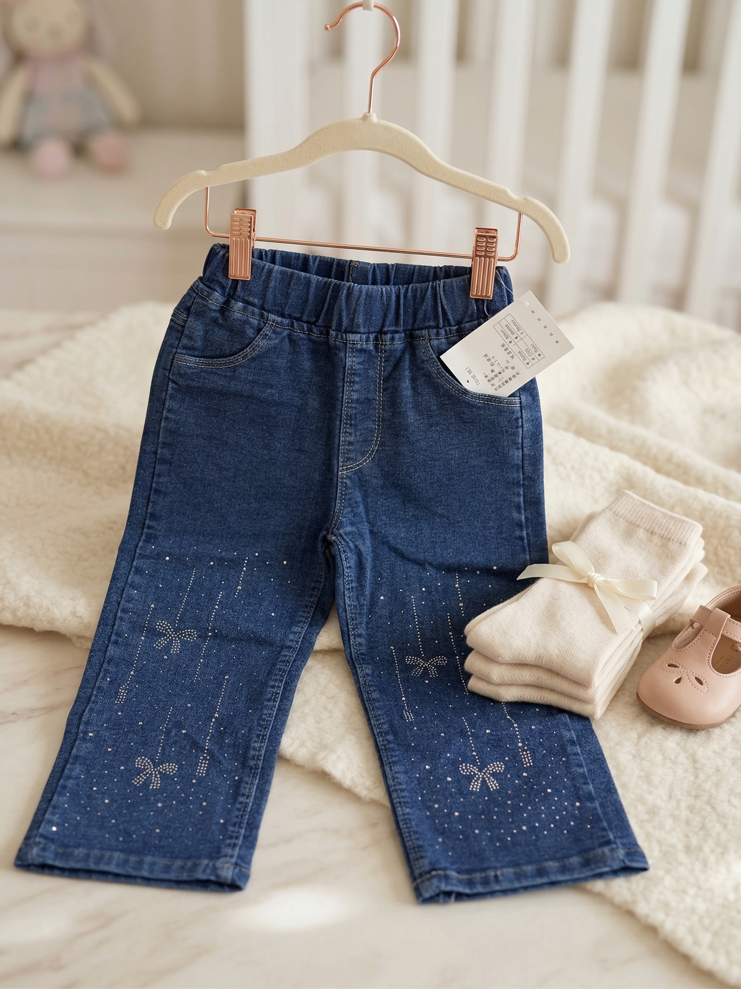 Blue stretch denim flare jeans with rhinestone bow detail for girls - kids fashion India