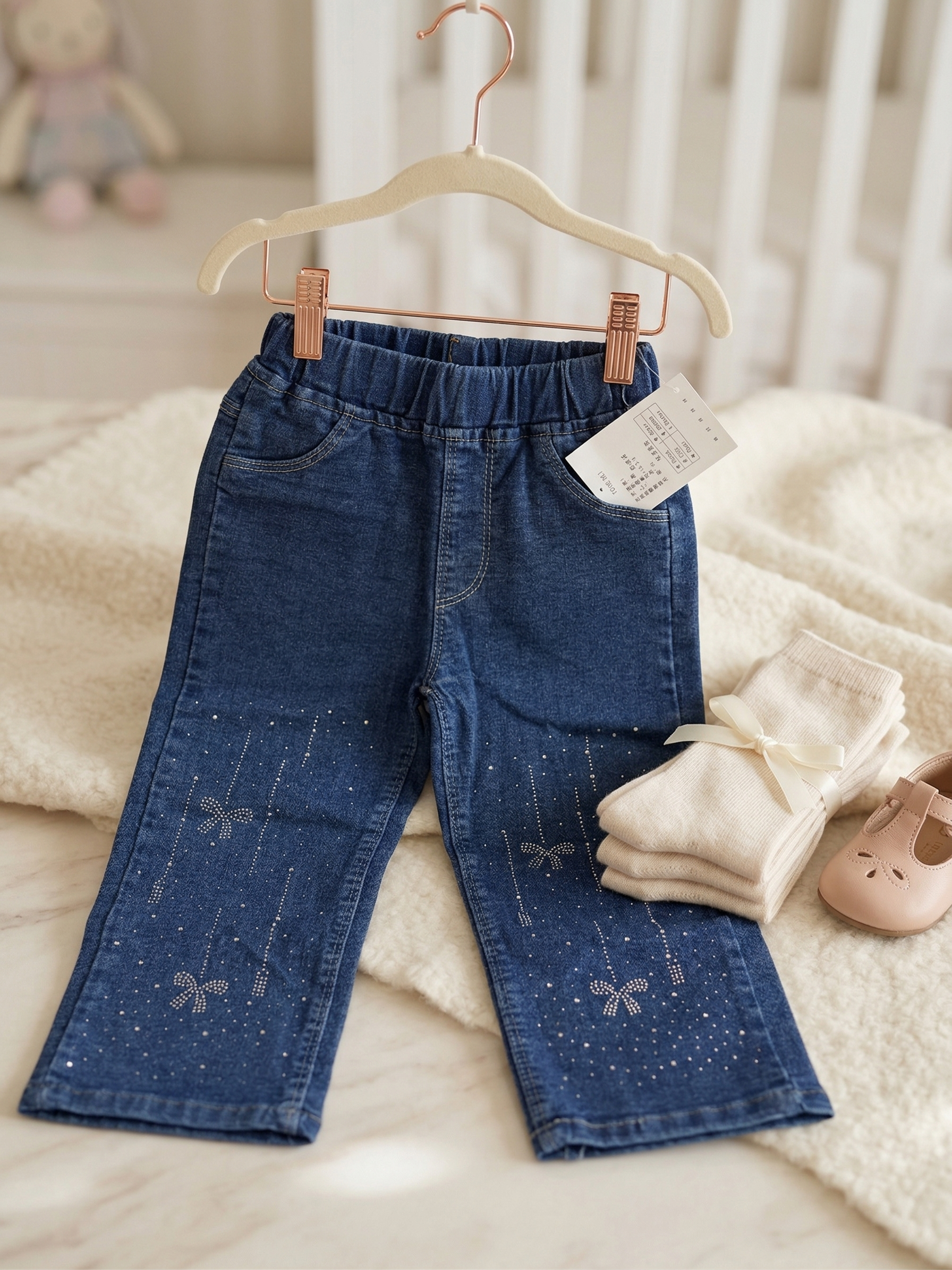Blue stretch denim flare jeans with rhinestone bow detail for girls - kids fashion India